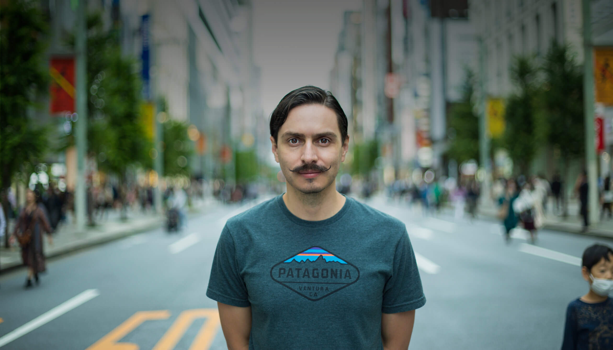 Portrait of Felipe Guarin, professional-looking man, looking into the distance with a confident expression.